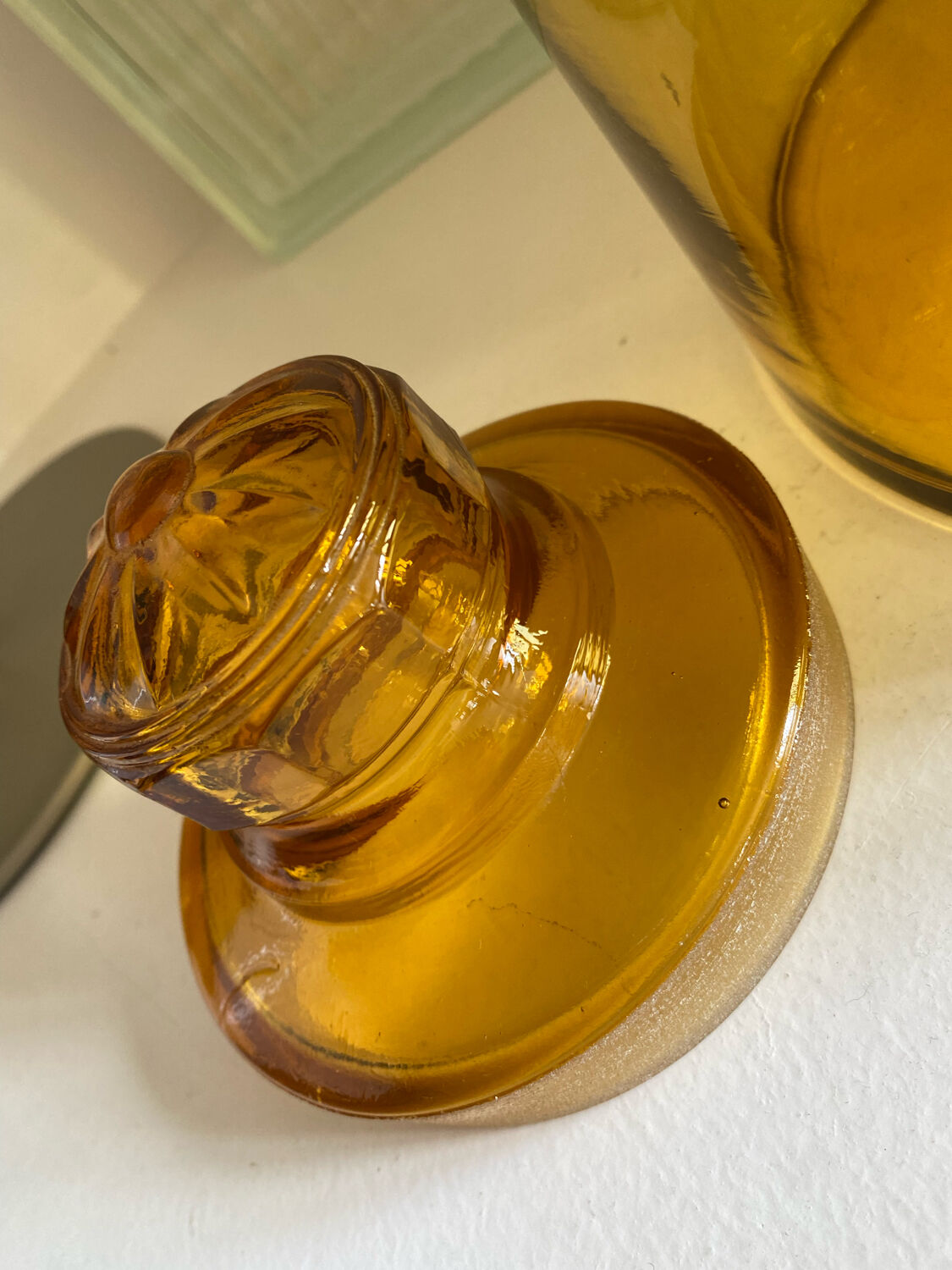 Old apothecary jar in blown amber glass