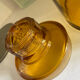Old apothecary jar in blown amber glass