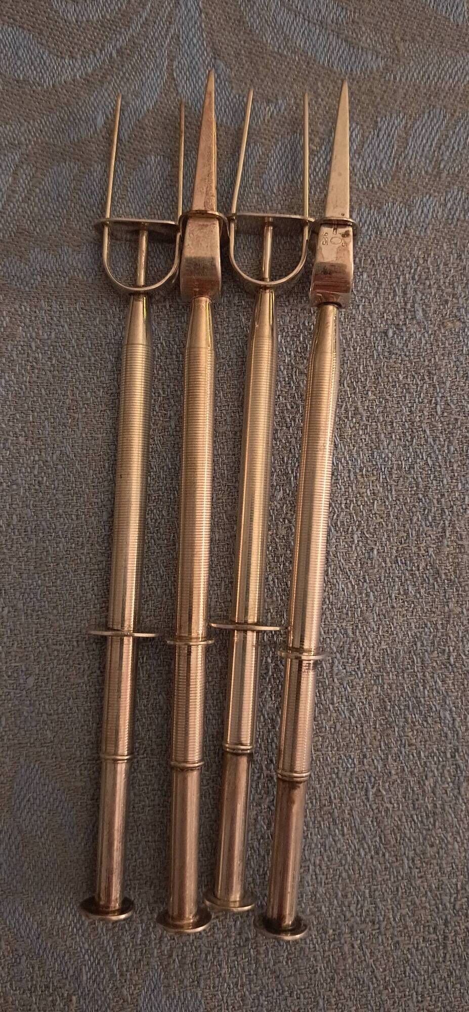 4 silver cocktail forks