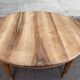 Art Deco round extendable dining table stripped in solid walnut from the 1920s.