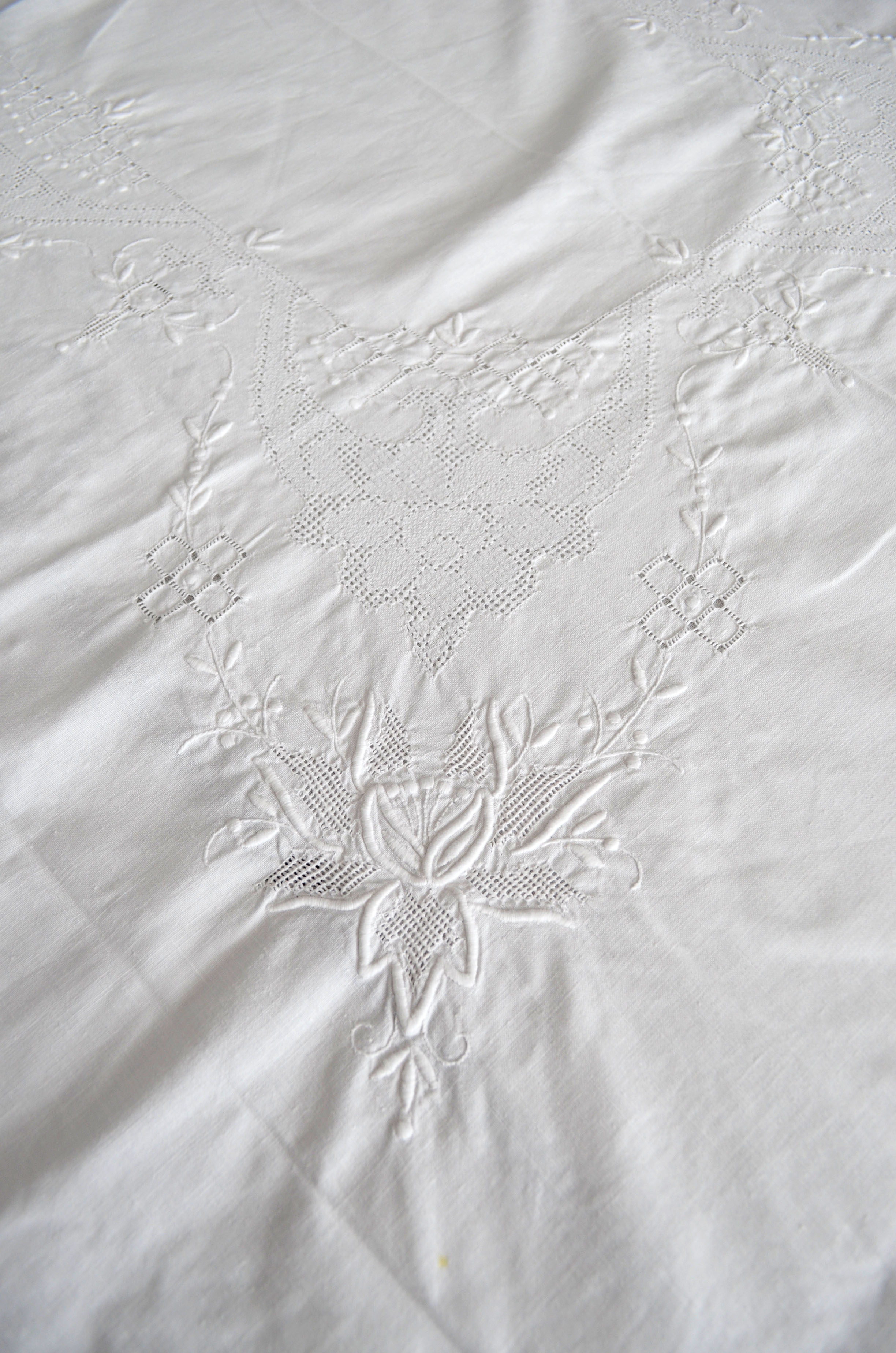 Old white tablecloth embroidered hand