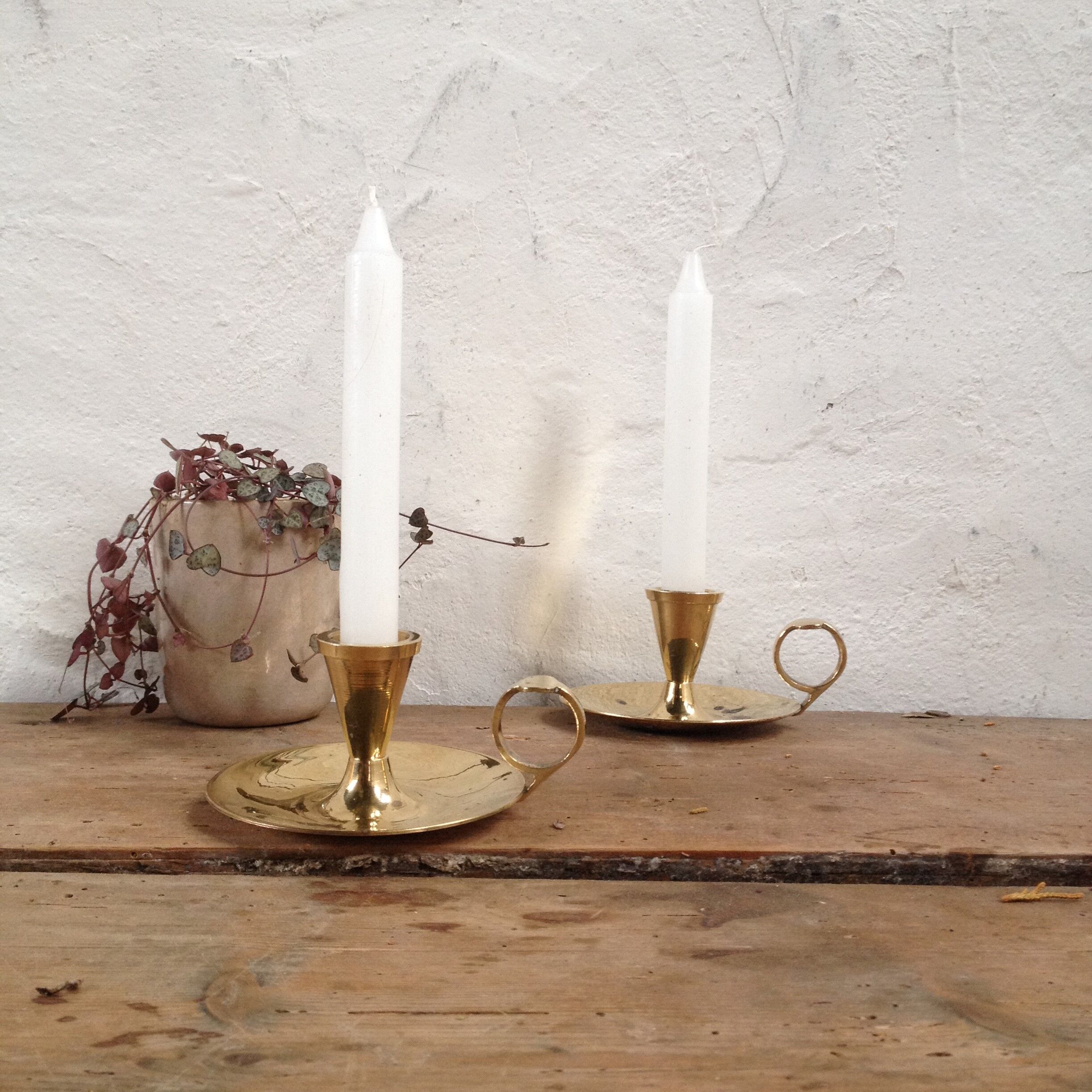 Pair of brass cellar rat candlesticks
