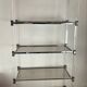 Vintage shelf in lucite, brass, and smoked glass from the 1970s.