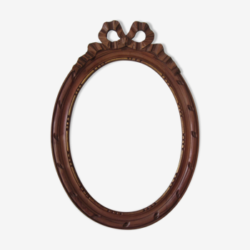Old frame with carved wooden knot