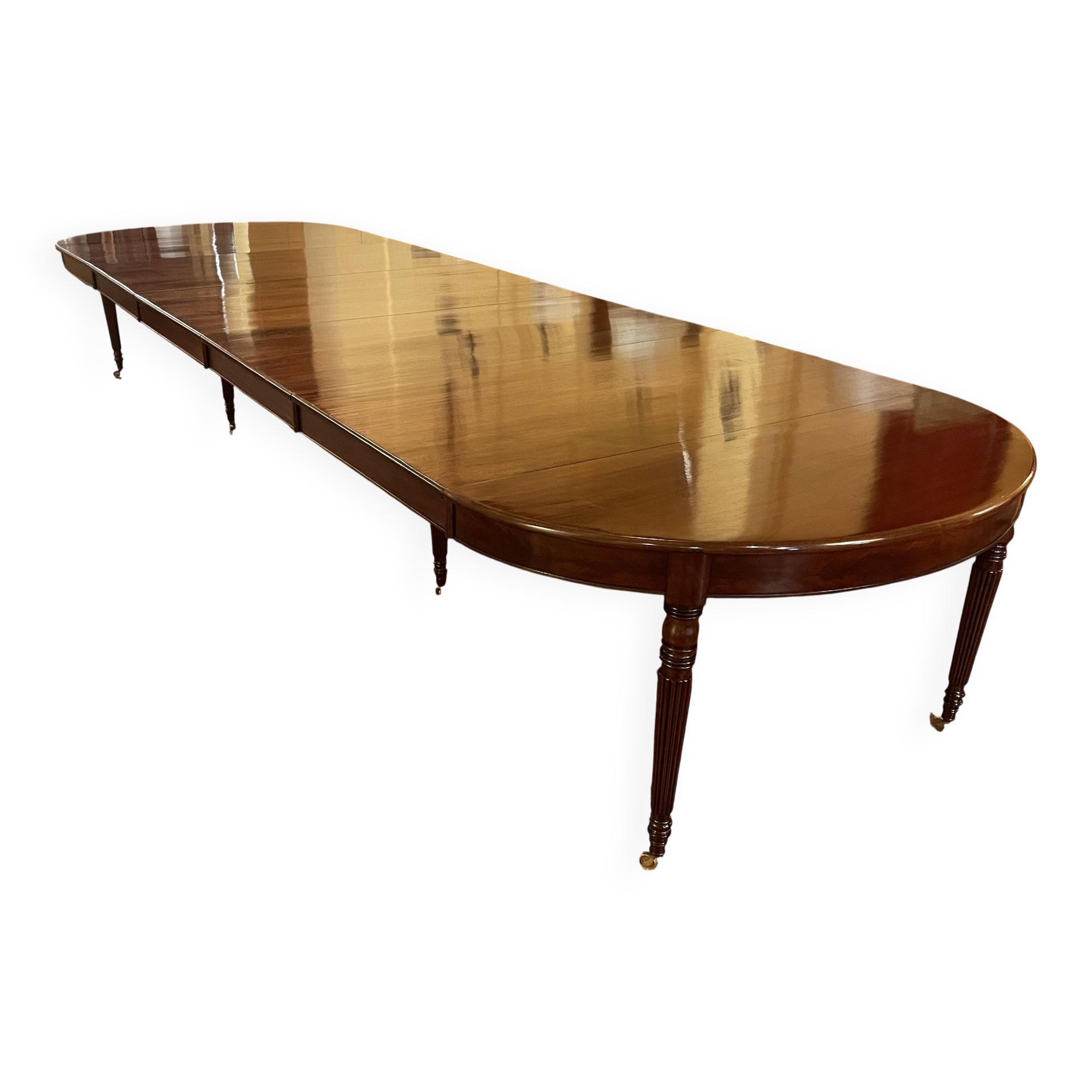 Extensible dining table from the Louis XVI period in mahogany with a banded top.