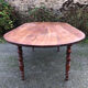 Antique cherry wood farmhouse table with rounded ends