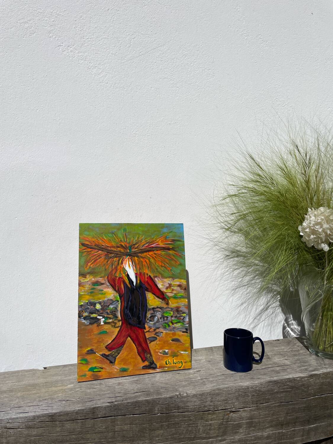 Painting of a woman in a field signed Lung