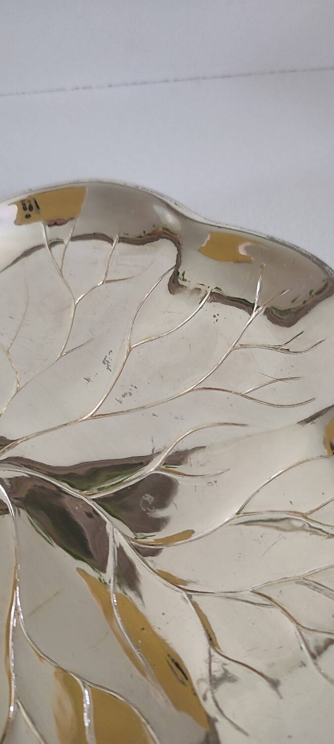 A Lancel pocket tray in silver metal.