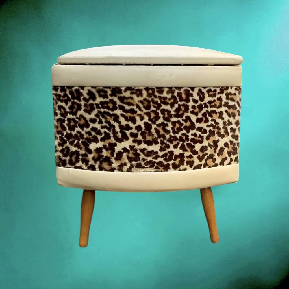 Vintage storage stool with compass legs in white faux leather and leopard velvet.