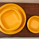Service of vintage orange plastic plates 70s