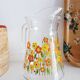Carafe en verre à décor floral, années 70