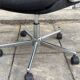 Black mottled fabric and chrome swivel armchair, 1