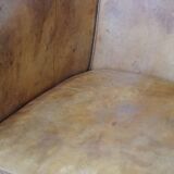 Comfortable, cozy, warm colored sheepskin club chair finished with decorative nails