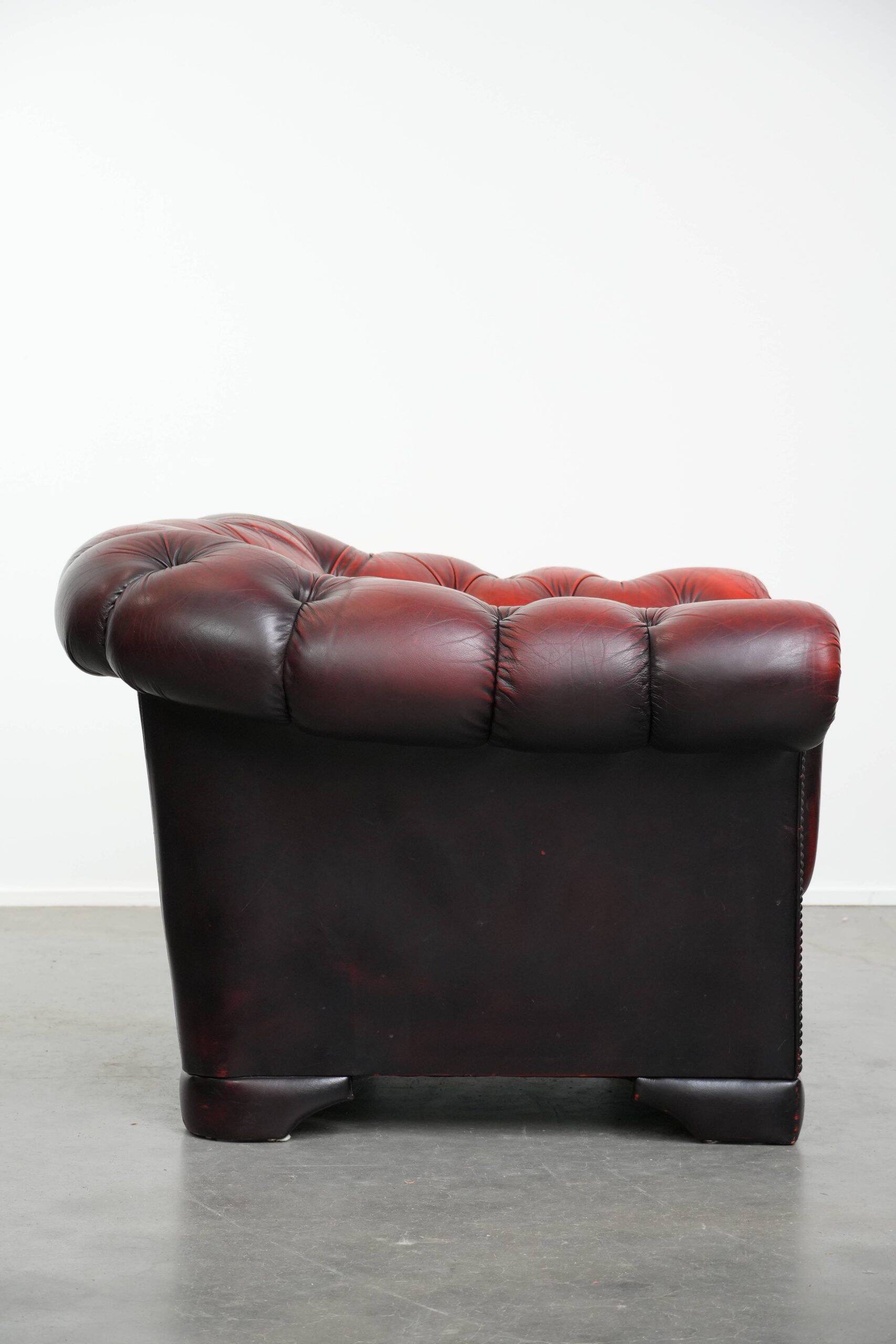 Classic cowhide Chesterfield button seat armchair in a beautiful red colour