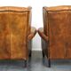 Set of 2 beautiful and correct sheep leather wingback armchairs with fixed seat cushions