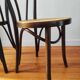 4 antique curved wood and cane chairs