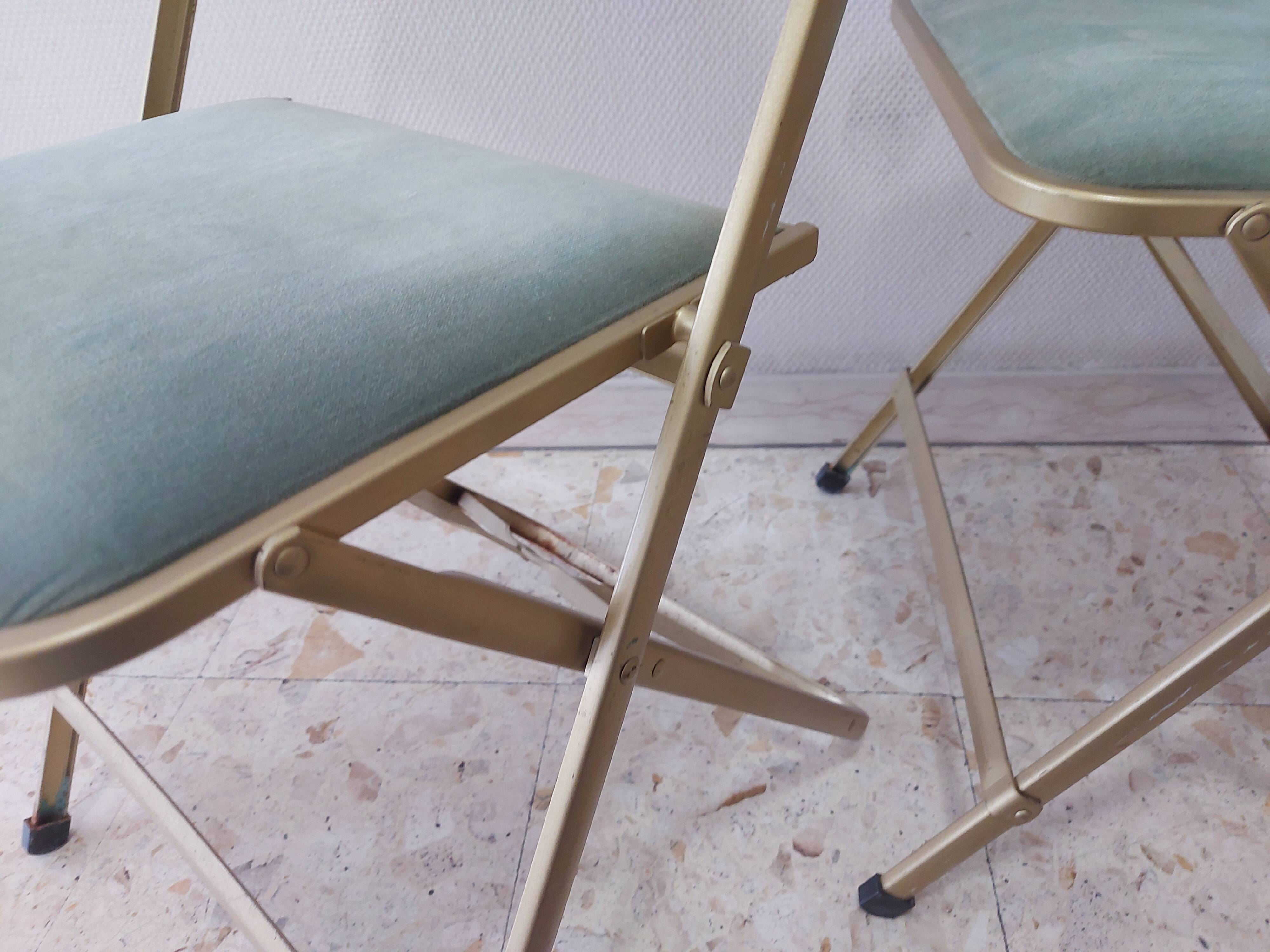 Two folding opera chairs in velvet