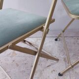 Two folding opera chairs in velvet