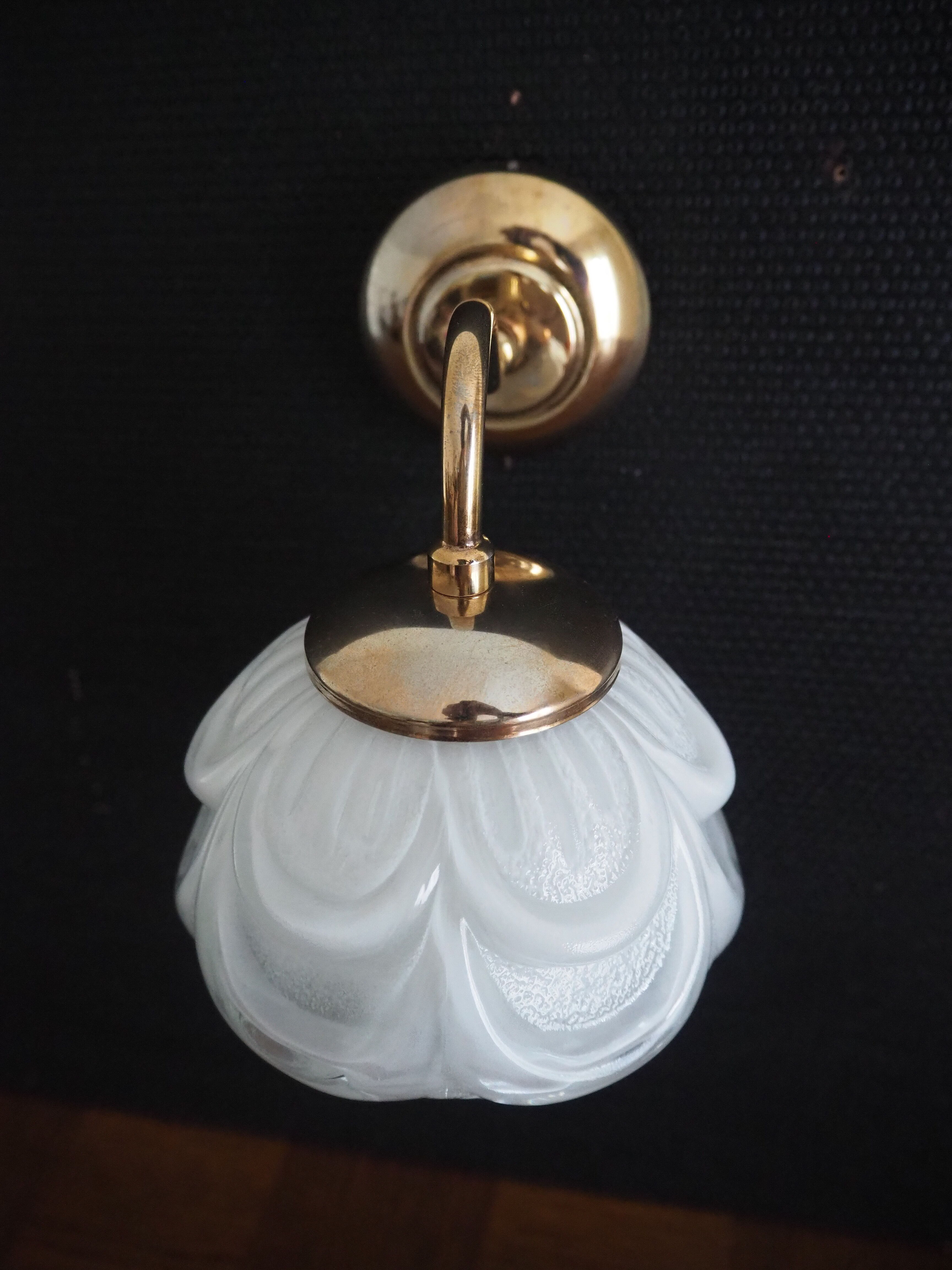 Brass wall lamp and white glass globe from the 1950s-1960s.