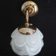 Brass wall lamp and white glass globe from the 1950s-1960s.
