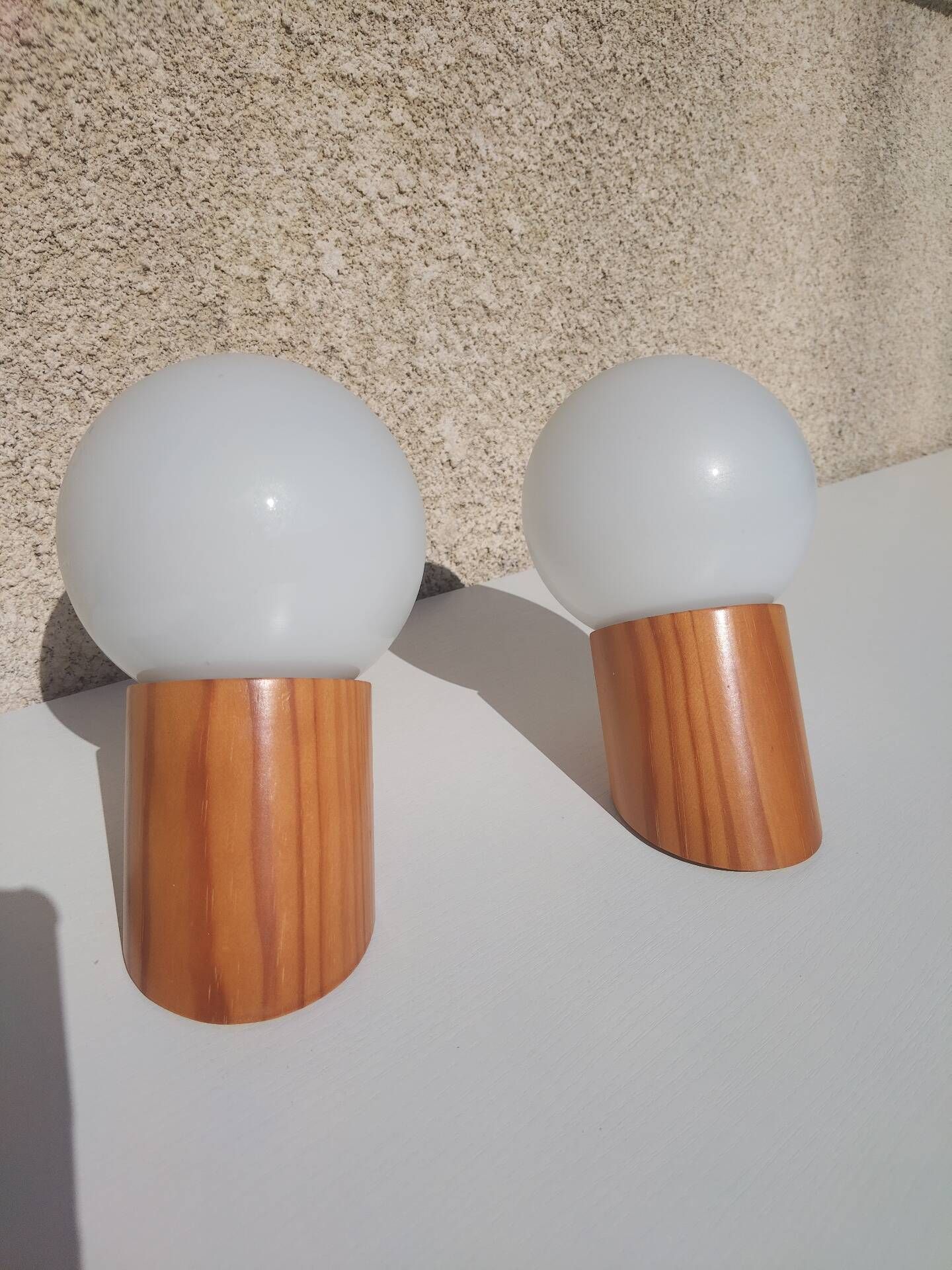 Pair of vintage wall lights in varnished pine and opal glass, 1970s-80s.