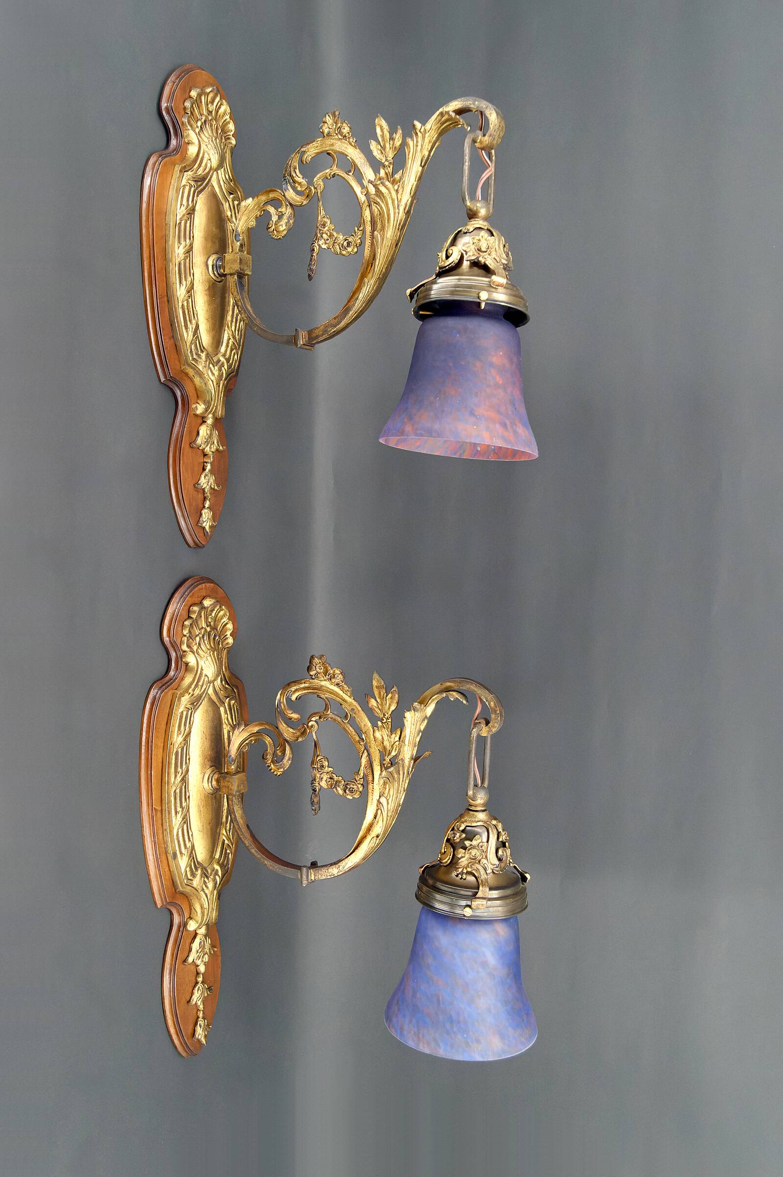 Pair of Rococo / Louis XV wall lights in gilded bronze, walnut bases and glass tulips, France, Circ