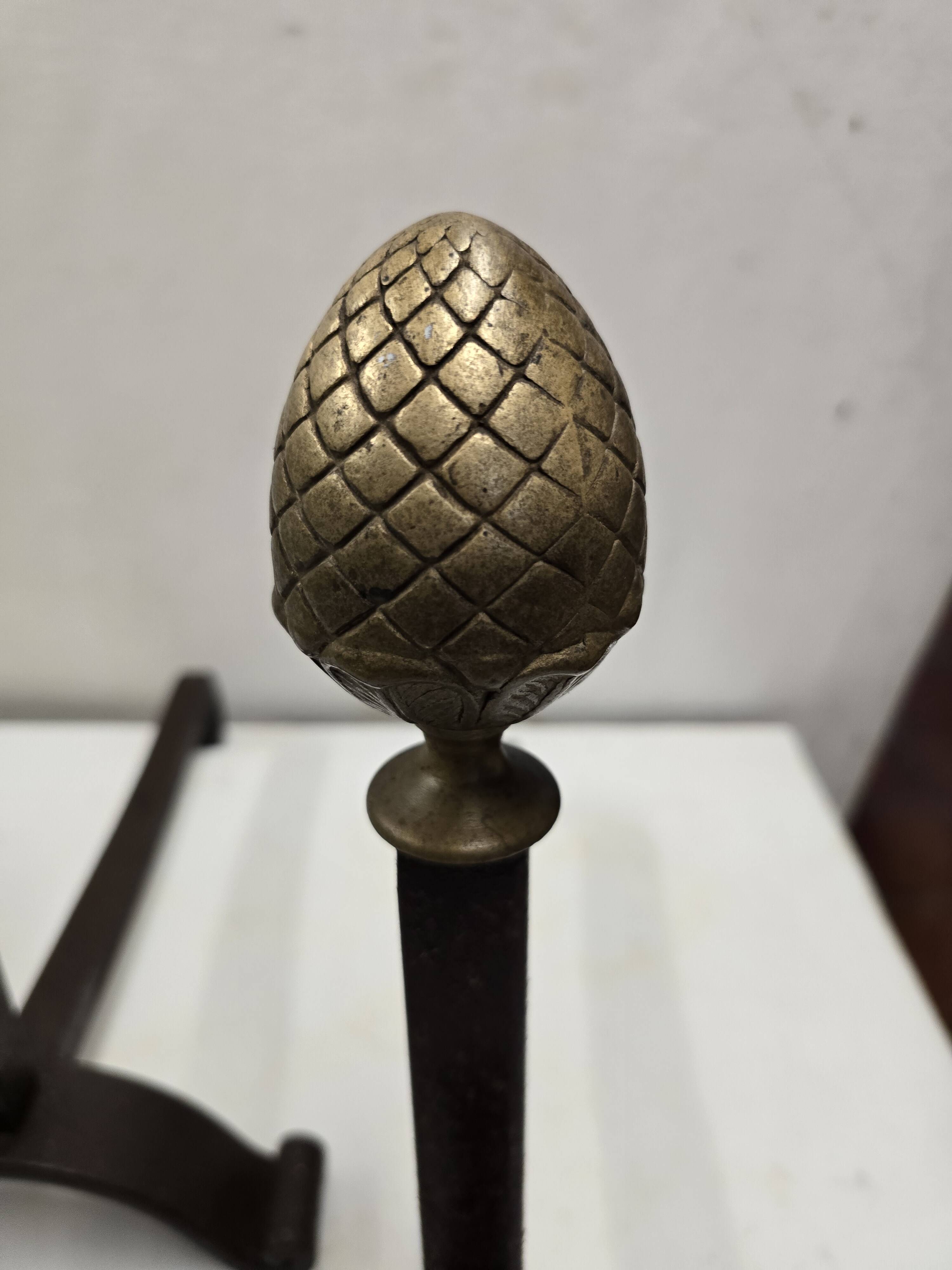 Old pair of wrought iron and bronze andirons