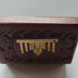 Old wooden box carved with flowers and brass