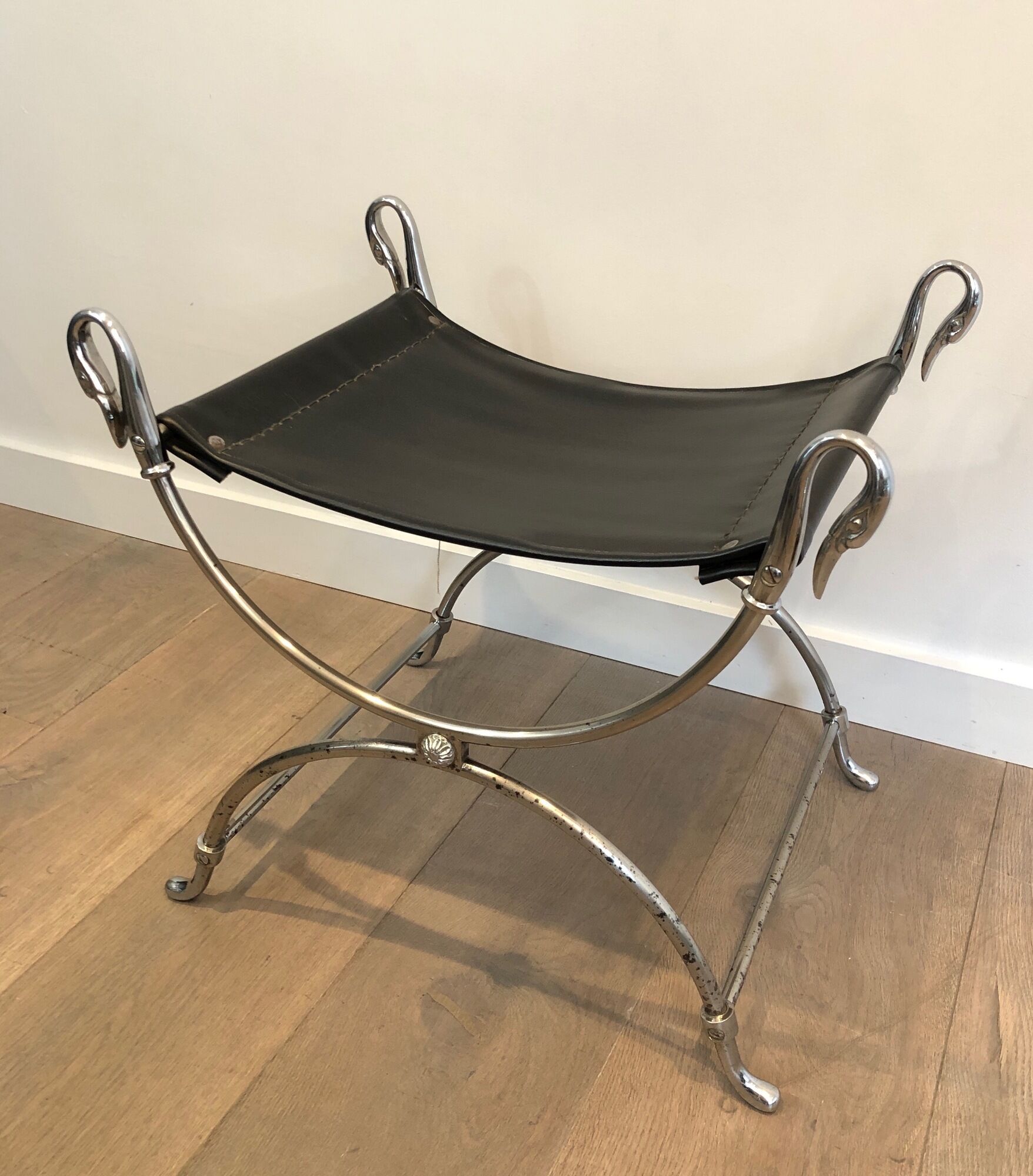 Curule stool in silver steel neoclassical style with swan heads