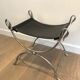 Curule stool in silver steel neoclassical style with swan heads
