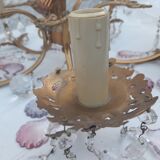 Antique chandelier with its papillae, reflection changing according to exposure