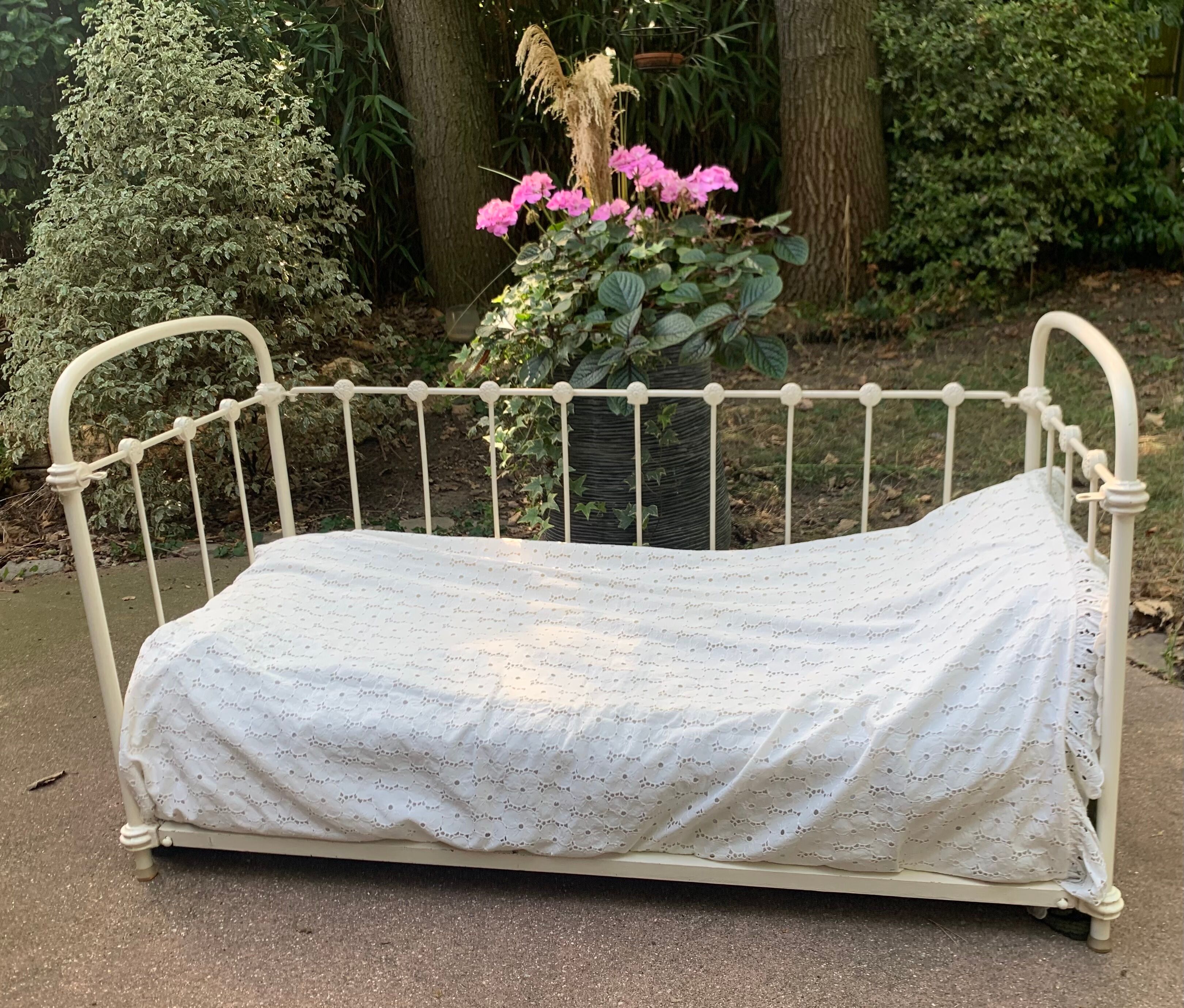 Wrought iron sofa bed with box spring.
