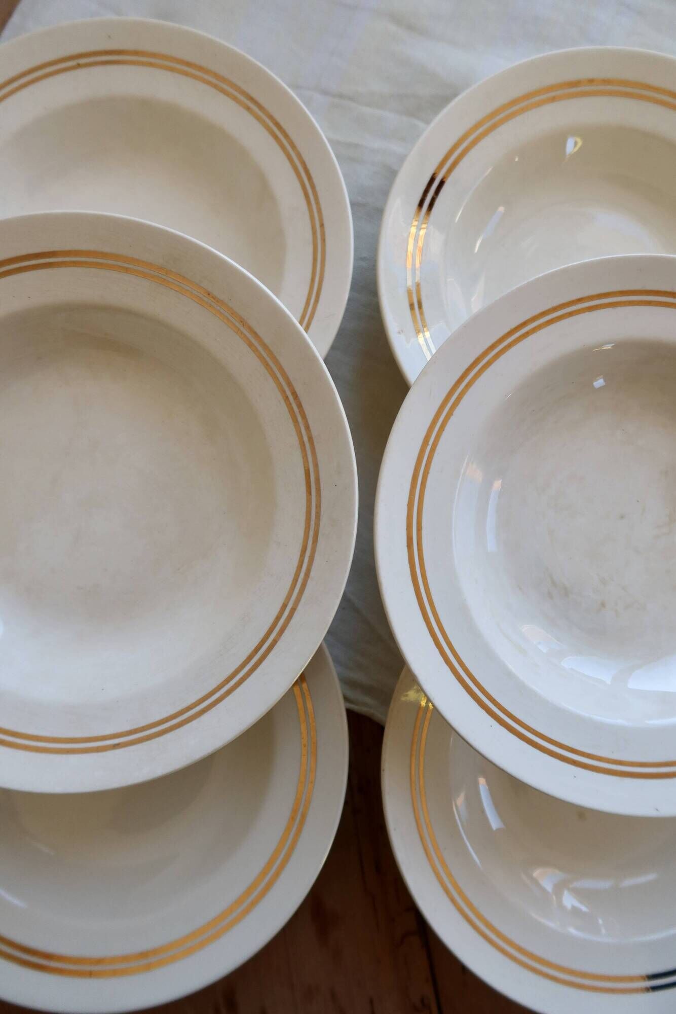 6 vintage ivory earthenware deep plates with double gold trim