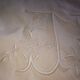 Antique embroidered linen sheet with a monogram.