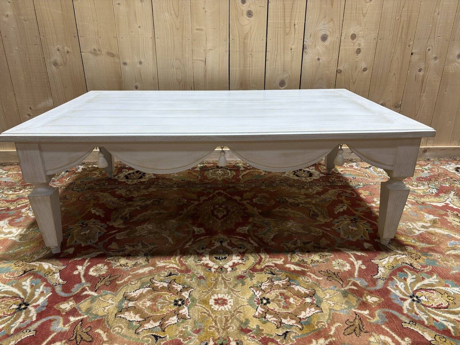 Painted wood coffee table with a distressed finish.