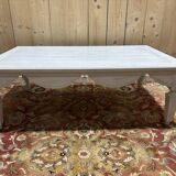 Painted wood coffee table with a distressed finish.