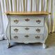 Curved patinated chest of drawers
