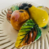 Covered basket in woven ceramic and fruit slip.