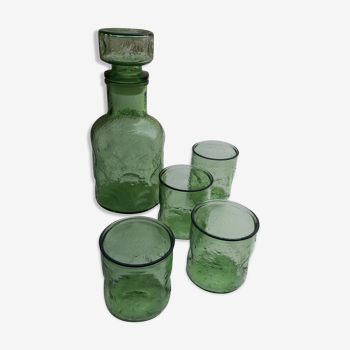 Green carafe in green bulb and assorted vintage glasses