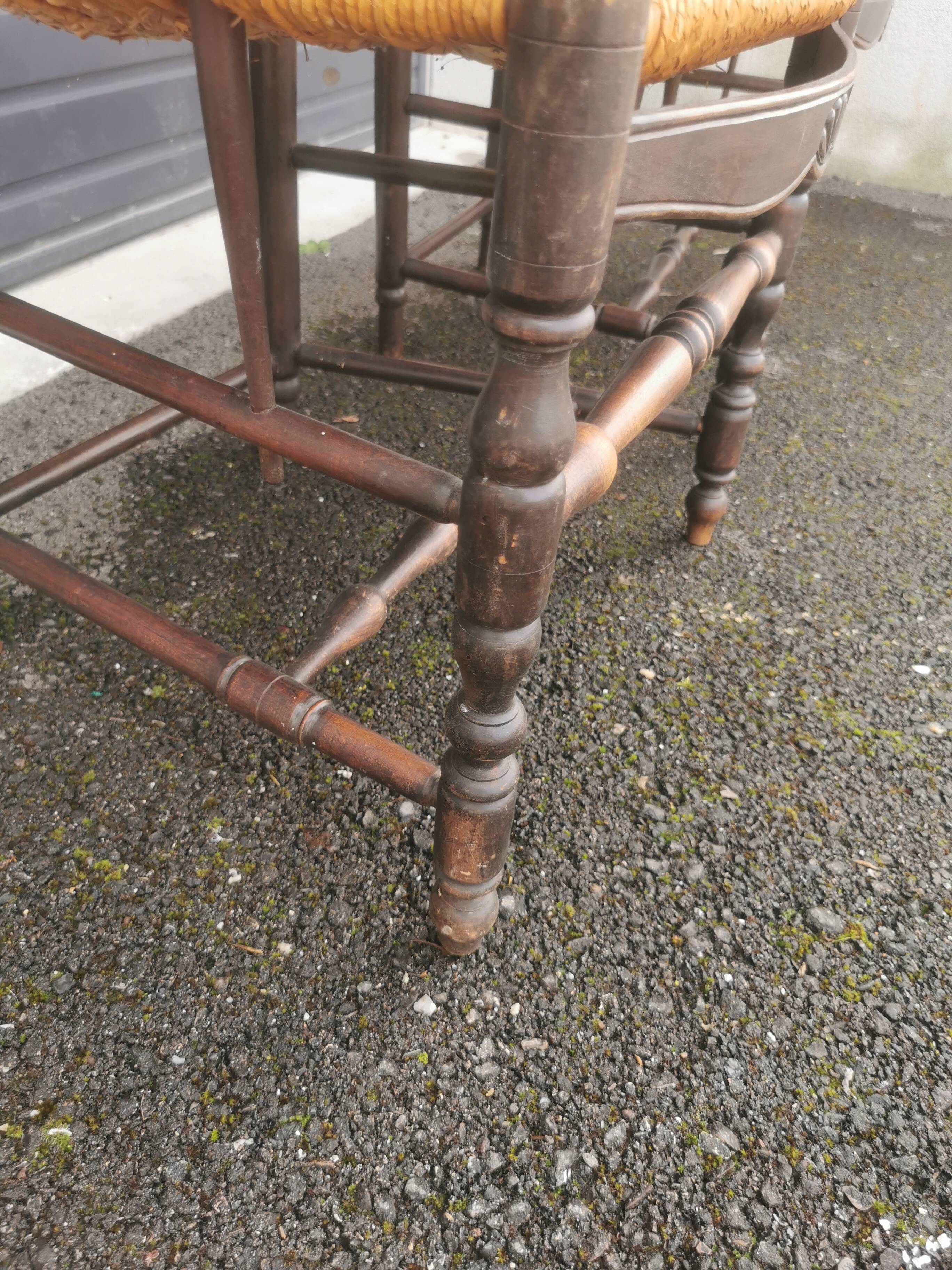 Pair of blackened wooden armchairs