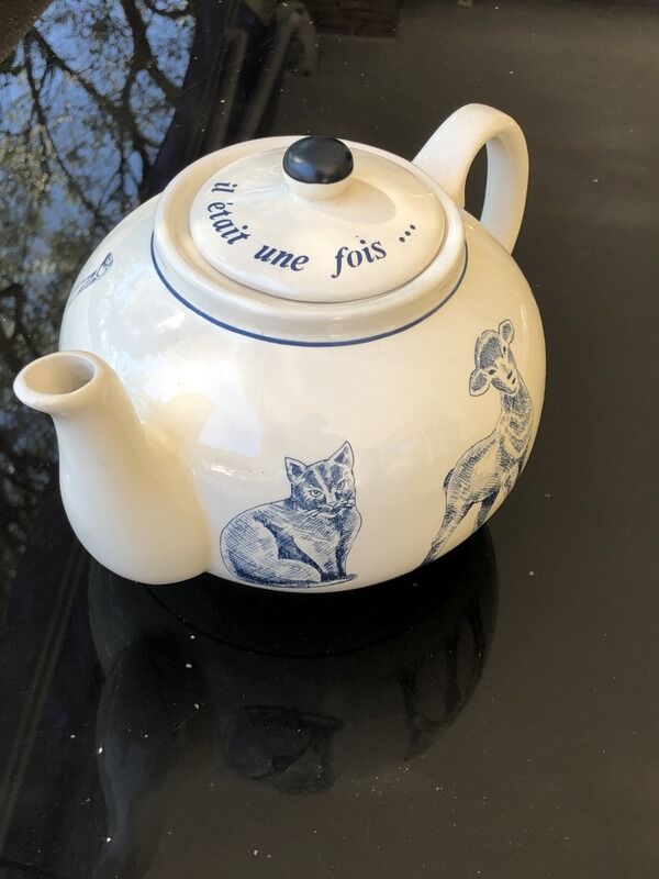 White porcelain teapot decorated with animals