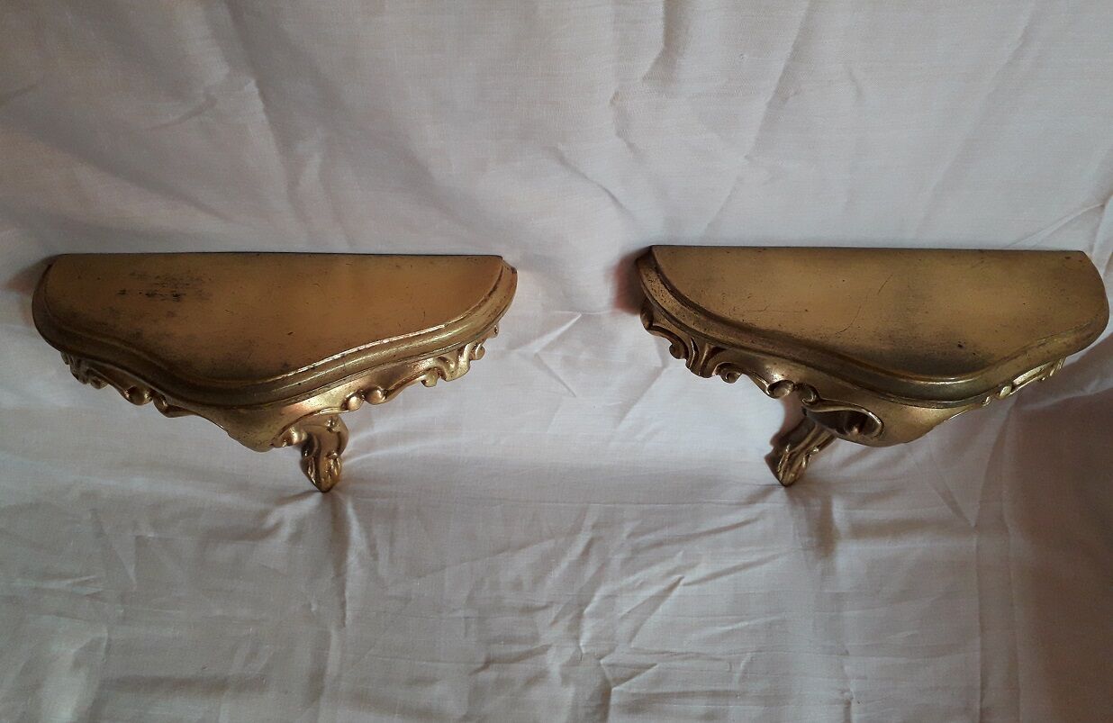 2 small golden wall shelves