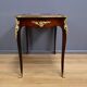 Rosewood, mahogany, and rosewood desk-table, Louis XV style – early 20th century.