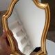 Vintage baroque mirror in gilded wood in the Louis XV style.