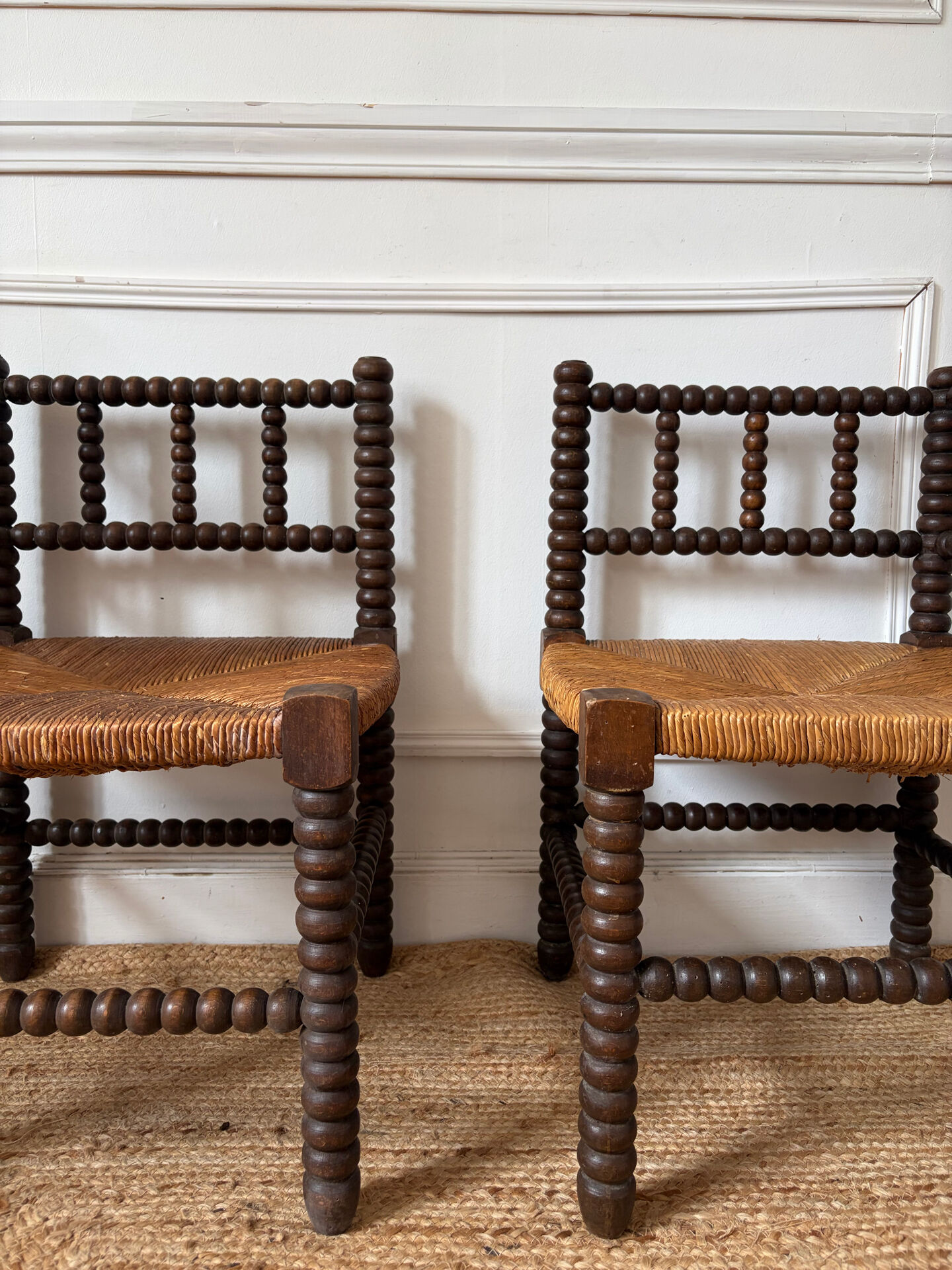 Pair of rush-seated chairs by the fireside "bobbin"