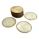 Set of 12 Mother of Pearl coasters with brass edging.