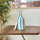 Artisanal vase, sky blue striped bottle.