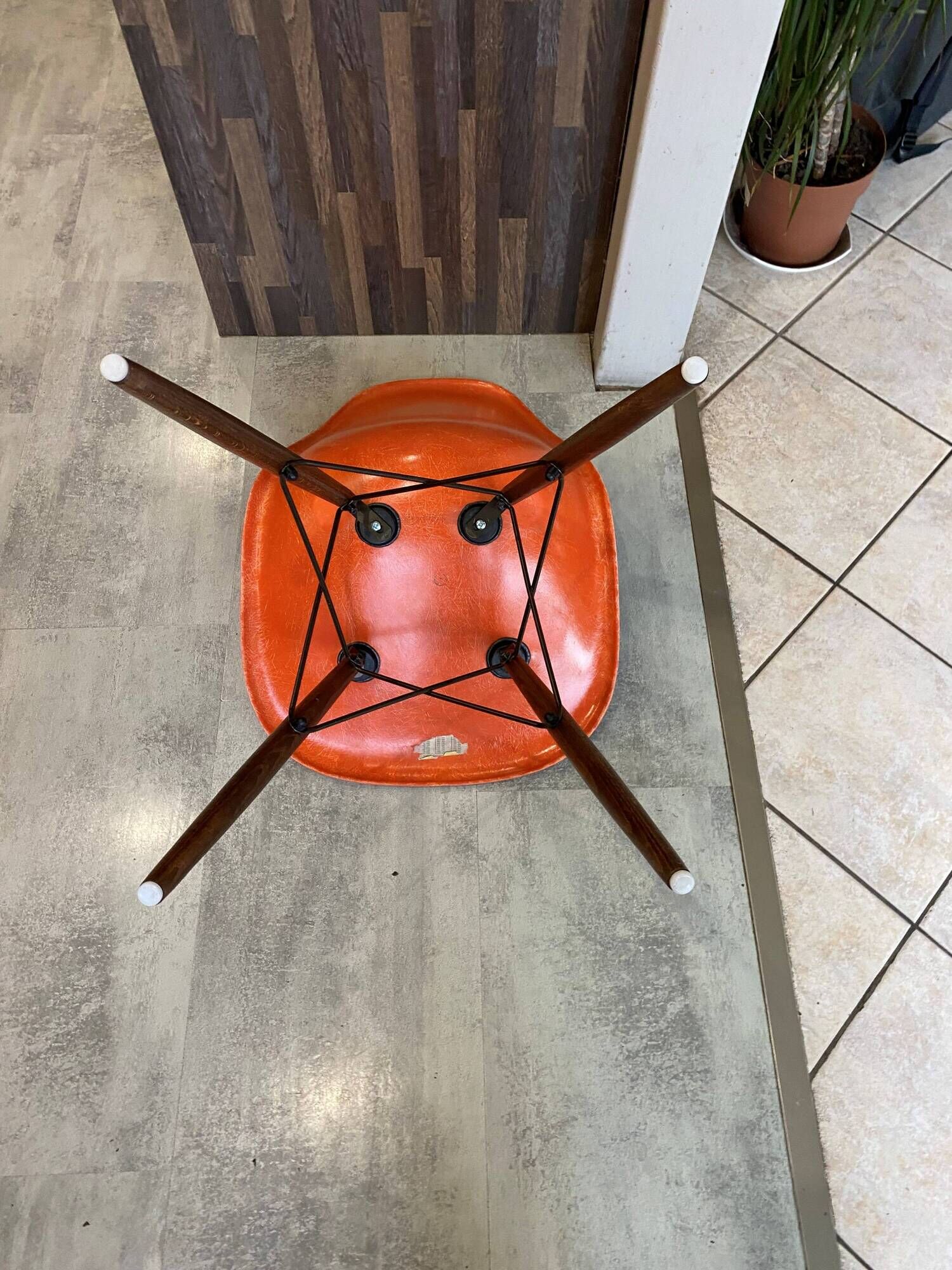 A vintage 70s Eames Herman Miller DSW Fiber Red Orange Dowel Walnut Chair