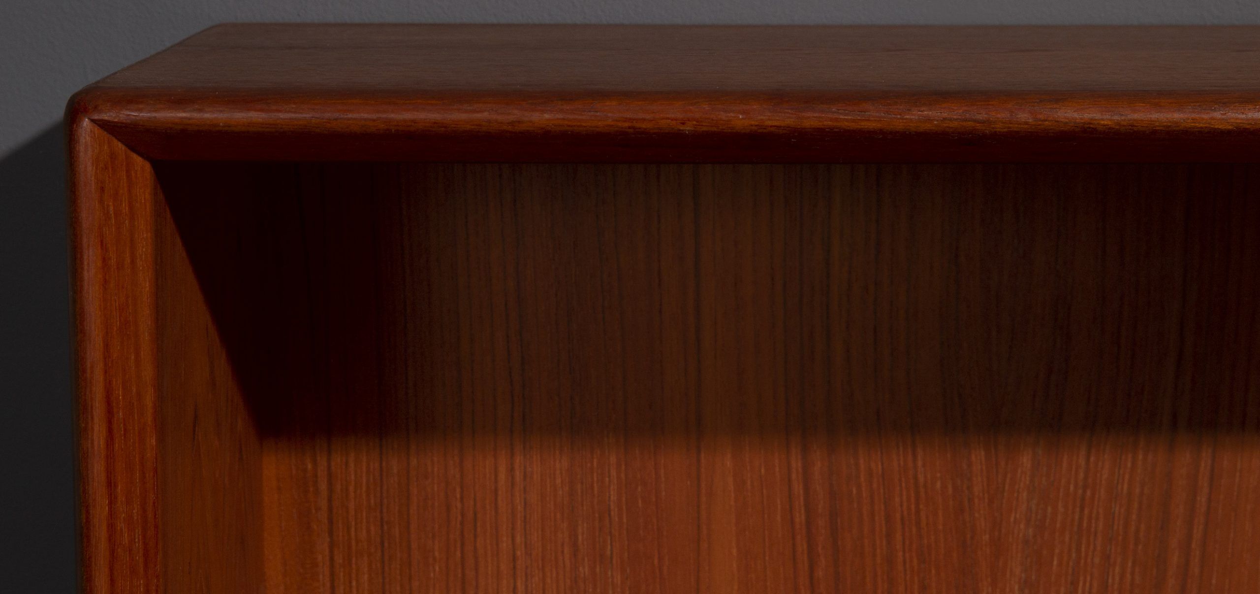 Teak wall cabinet with sliding glass doors