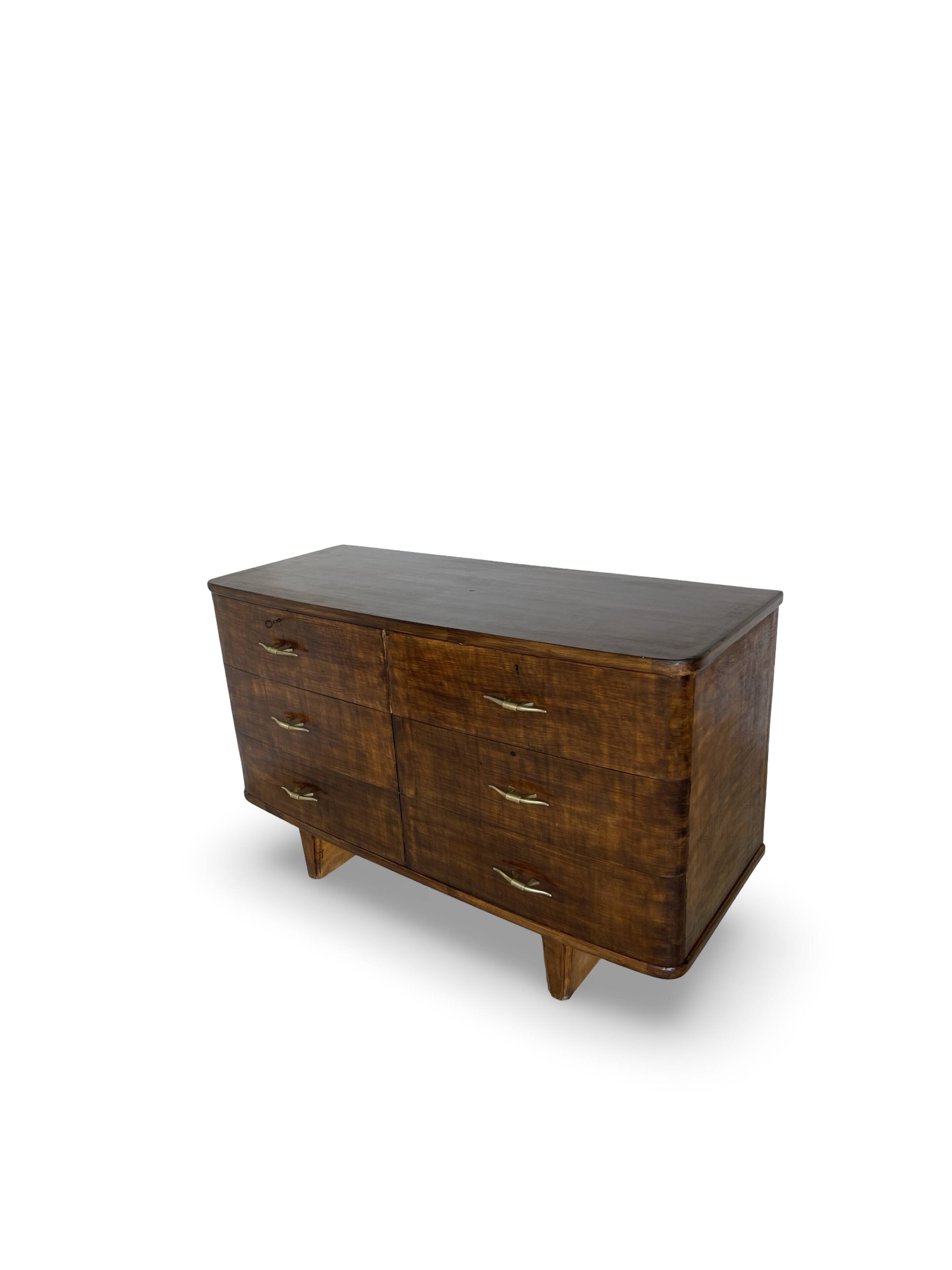 A vintage Italian chest of drawers, made of veneered walnut and solid wood,